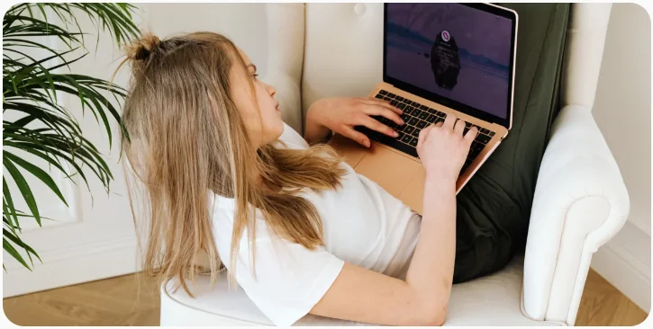 a person and a girl using a laptop